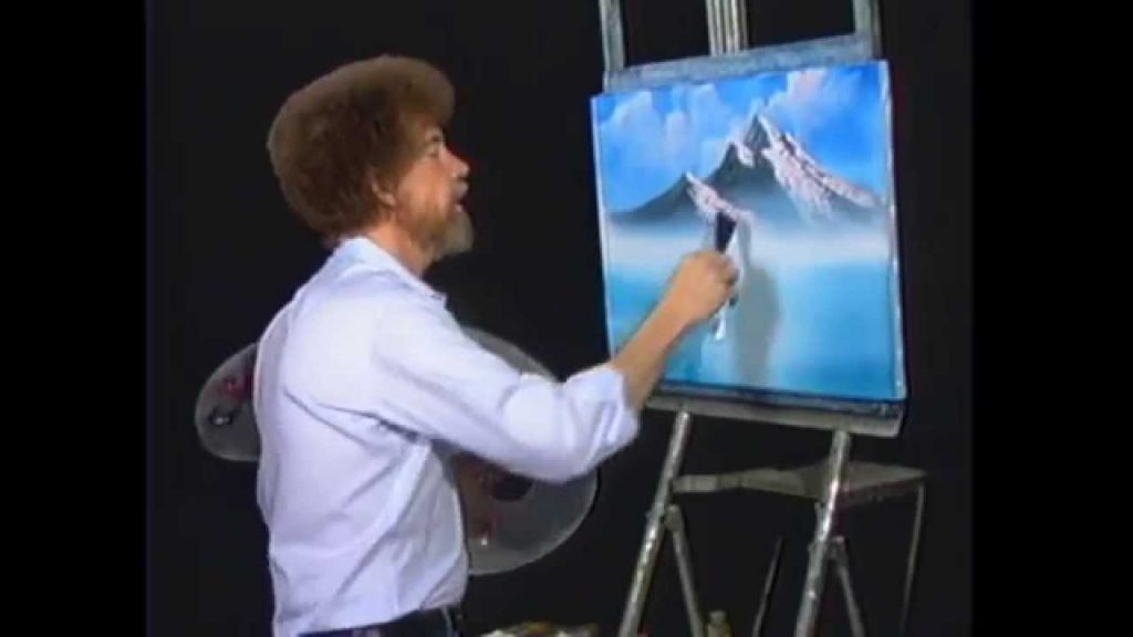 Bob Ross painting a mountain