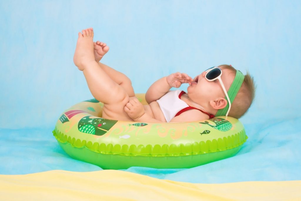 A baby in a swimming pool